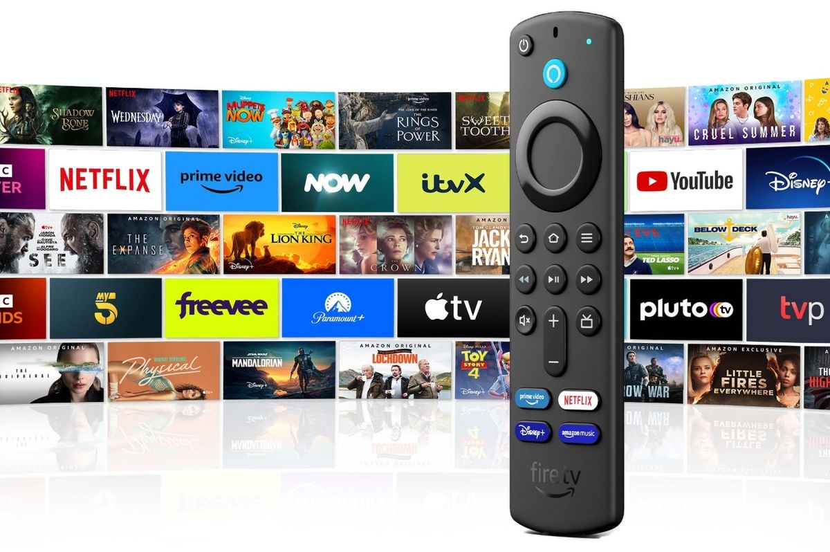 fire tv stick pictured standing with a grid of the apps, streaming services, and games on fireos 