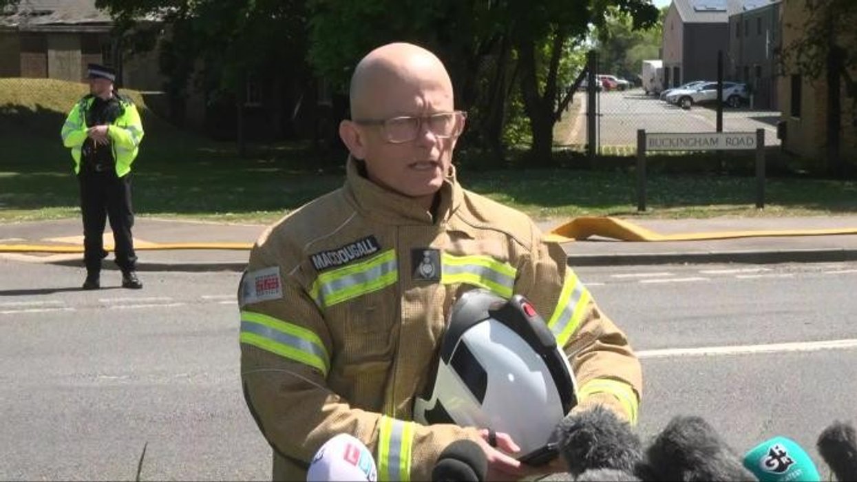 Firefighter chokes back tears as he gives emotional update on Bicester fire which killed two of his colleagues