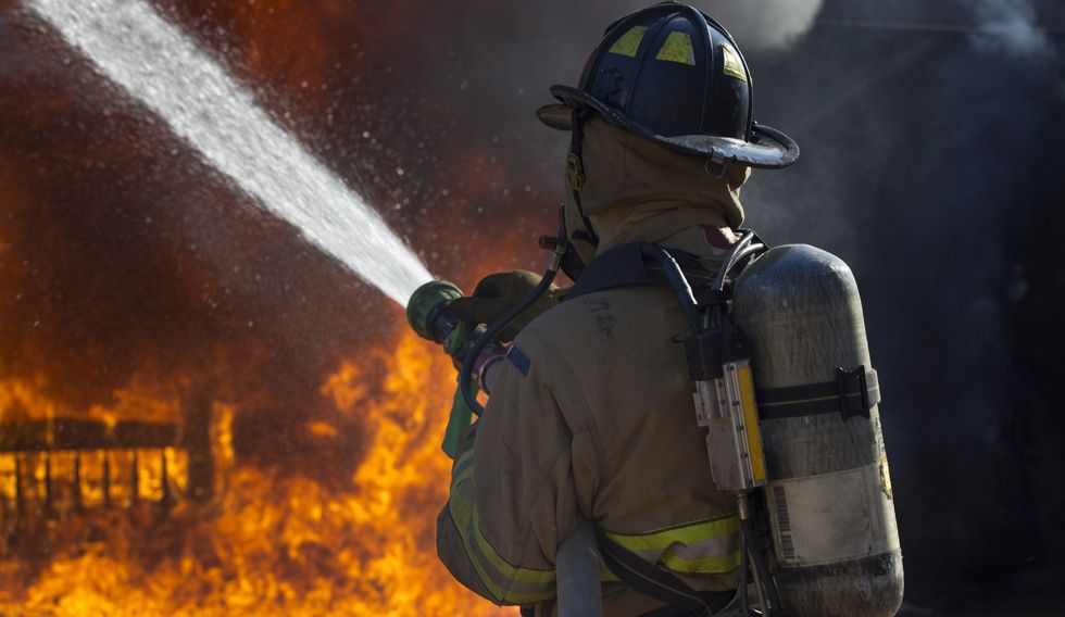 Firefighter putting out fire