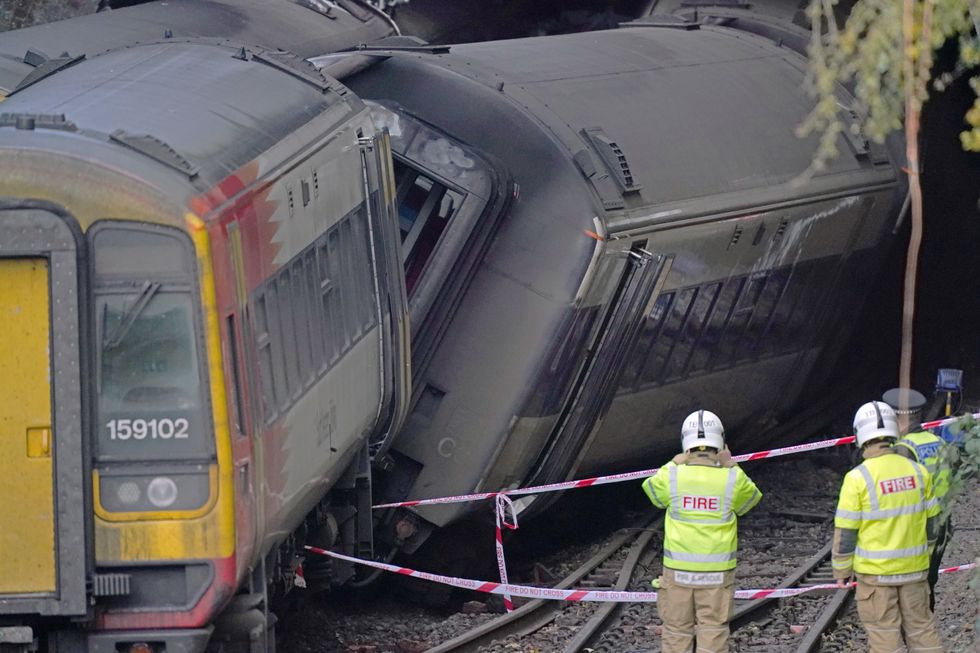 Firefighters at the scene of a crash involving two trains near the Fisherton Tunnel between Andover and Salisbury in Wiltshire.