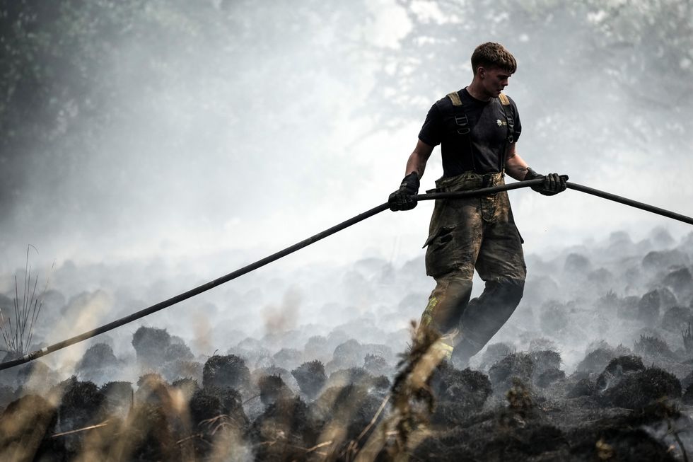 Firefighters contain a wildfire that encroached on nearby homes in the Shiregreen area of Sheffield