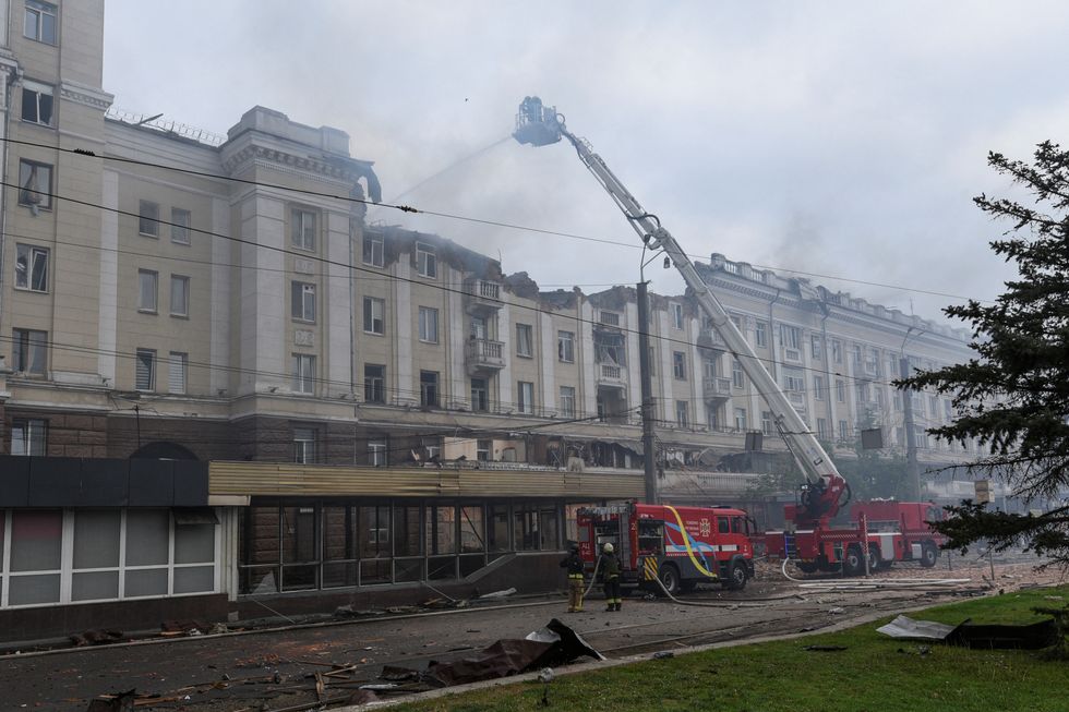 Firefighters in action on an apartment building hit by a Russian missile strike
