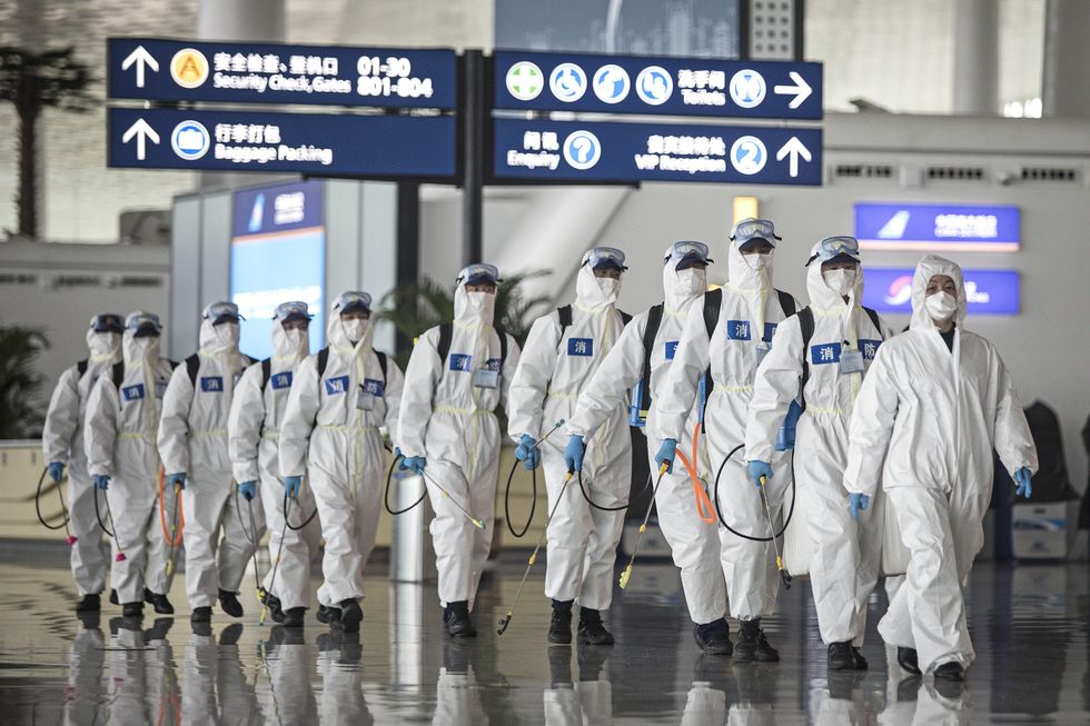 Firefighters prepare to conduct disinfection at the Wuhan Tianhe International Airport