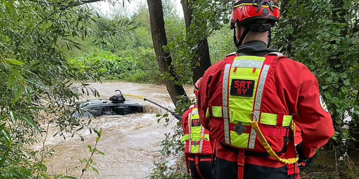NextImg:Lucky driver rescued from submerged car in Shropshire after severe flooding in shocking photos