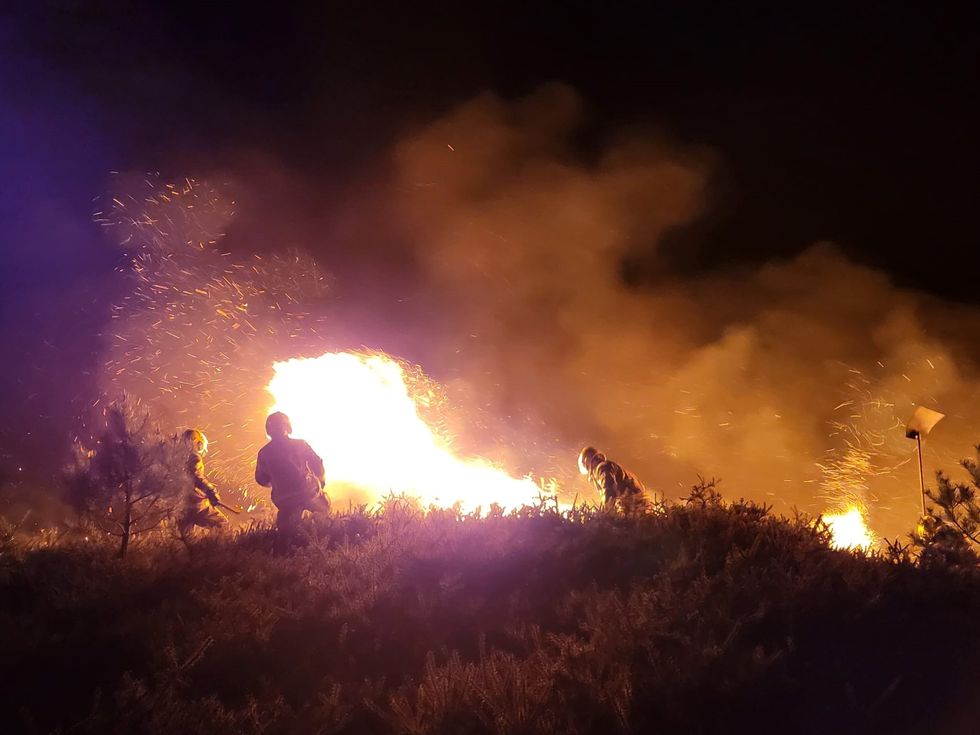 Firefighters tackling the blaze at Upton Heath