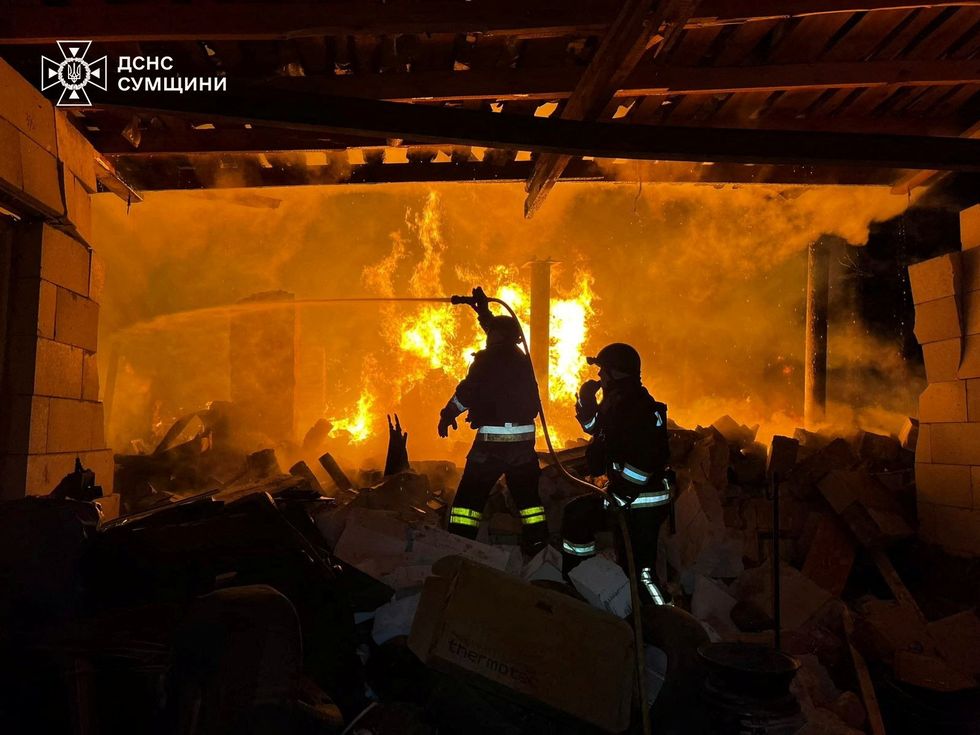 Firefighters work at the site of a Russian military strike, amid Russia's attack on Ukraine, in Sumy region