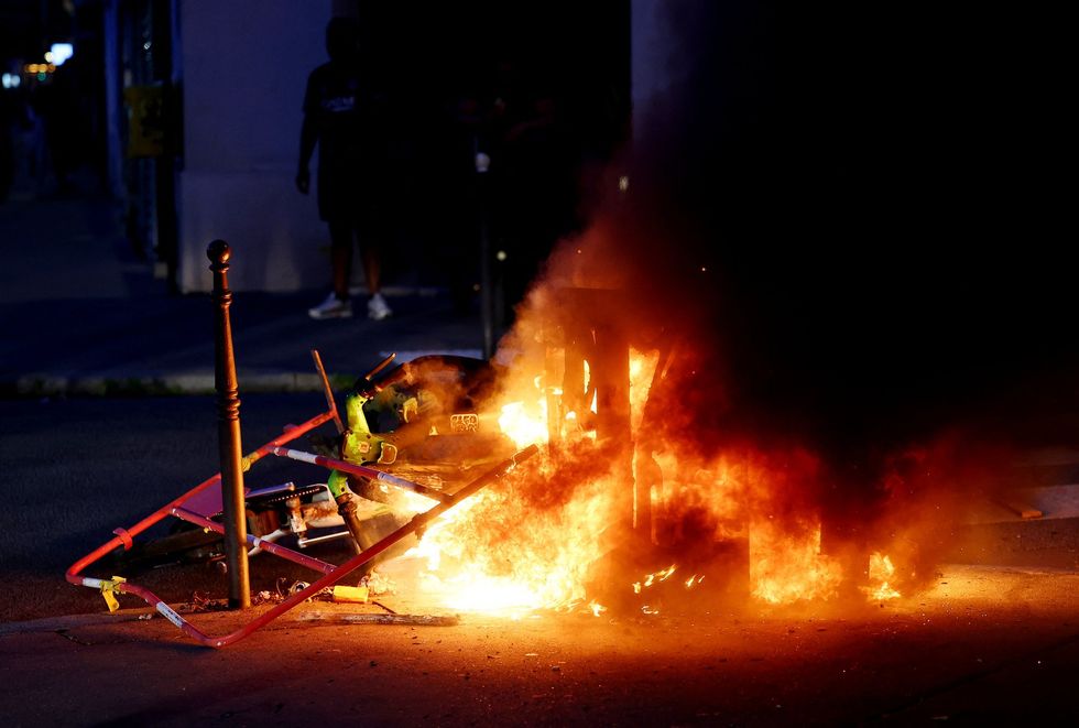 Fires broke out across Paris after full-time as PSG beat Arsenal