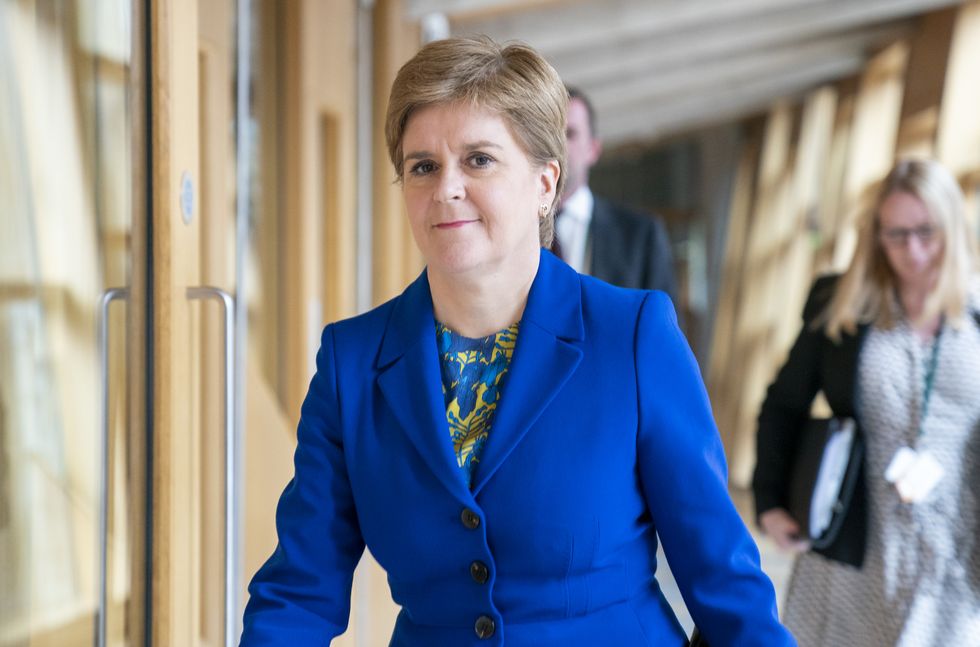 First Minister Nicola Sturgeon arrives ahead of First Minster's Questions (FMQ's) in the debating chamber of the Scottish Parliament in Edinburgh. Picture date: Thursday September 8, 2022.