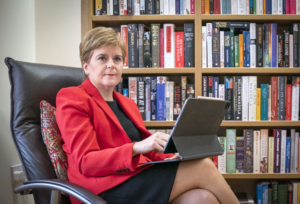 First Minister Nicola Sturgeon at her home in Glasgow preparing her speech she will give to the SNP National Conference virtually on Monday.