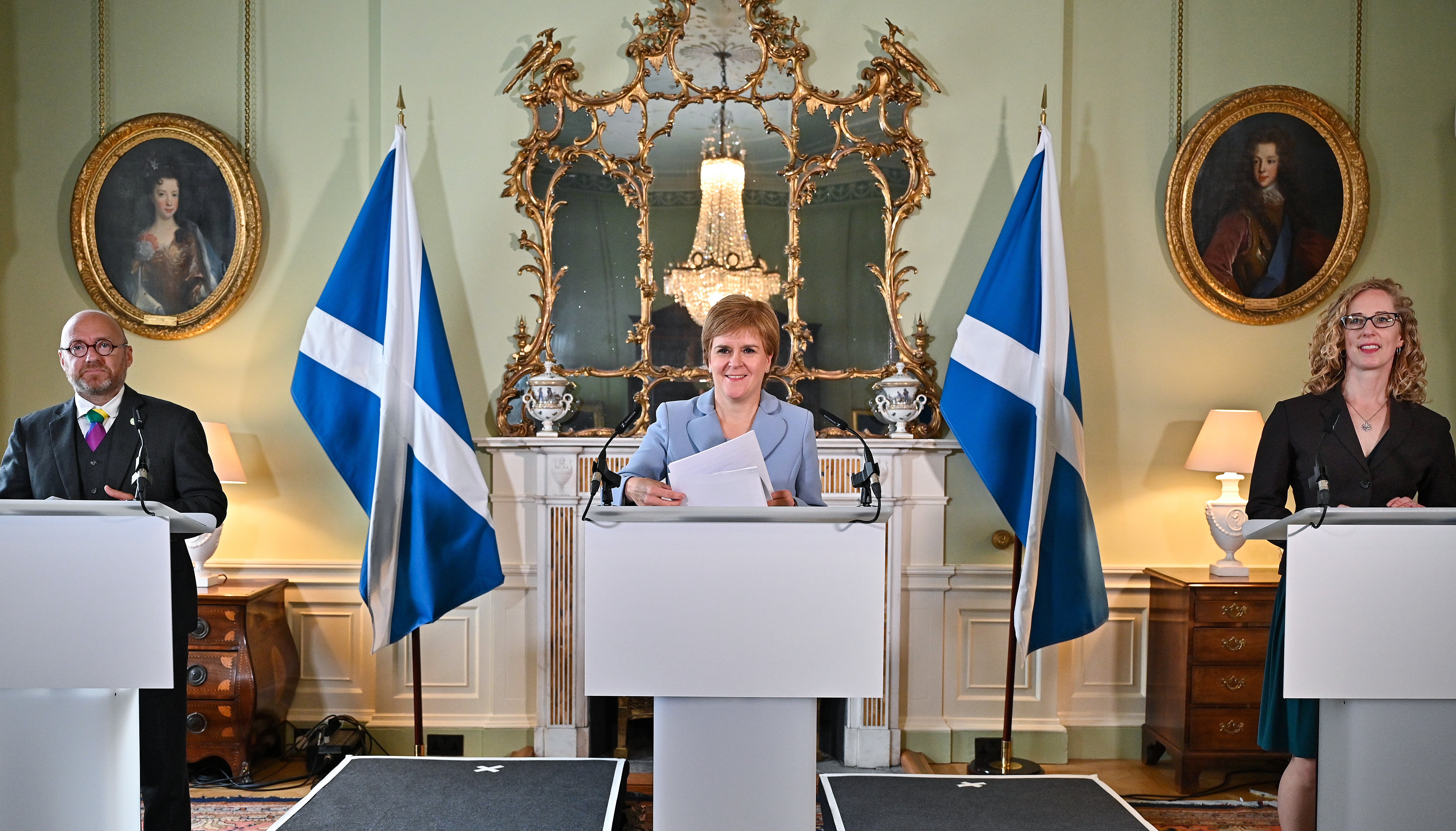 First Minister Nicola Sturgeon (centre) and Scottish Green Party co-leaders Patrick Harvie (left) and Lorna Slater (right) at Bute House, Edinburgh, after the finalisation of an agreement between the SNP and the Scottish Greens to share power in Scotland.