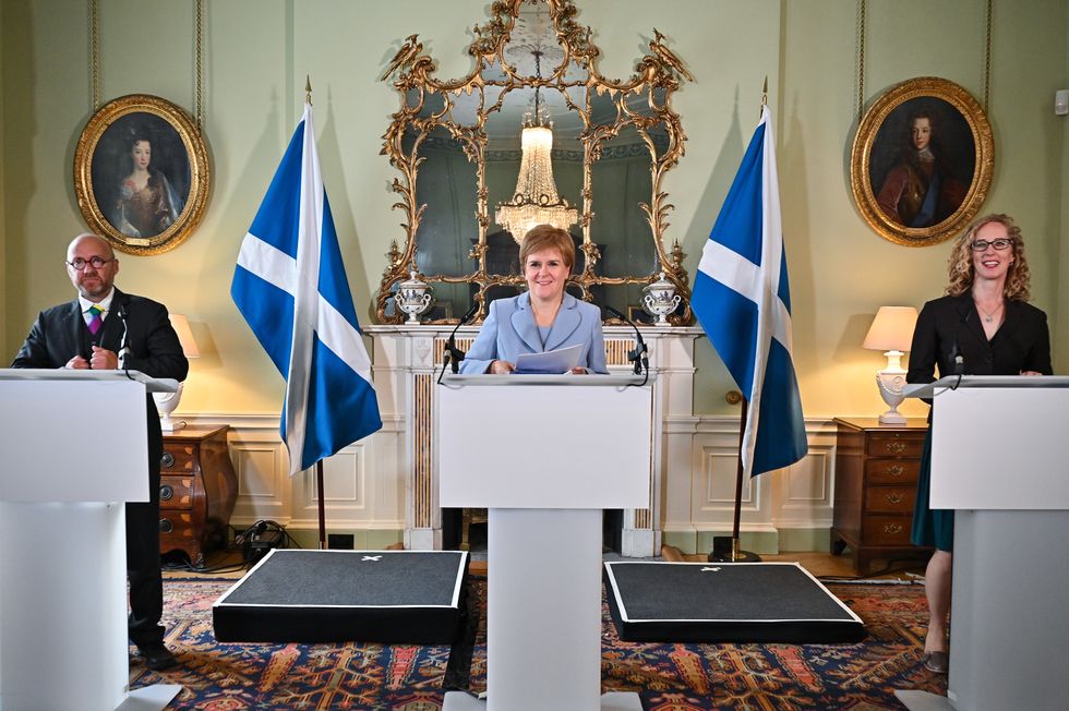 First Minister Nicola Sturgeon (centre) and Scottish Green Party co-leaders Patrick Harvie (left) and Lorna Slater (right) at Bute House, Edinburgh, after the finalisation of an agreement between the SNP and the Scottish Greens to share power in Scotland.