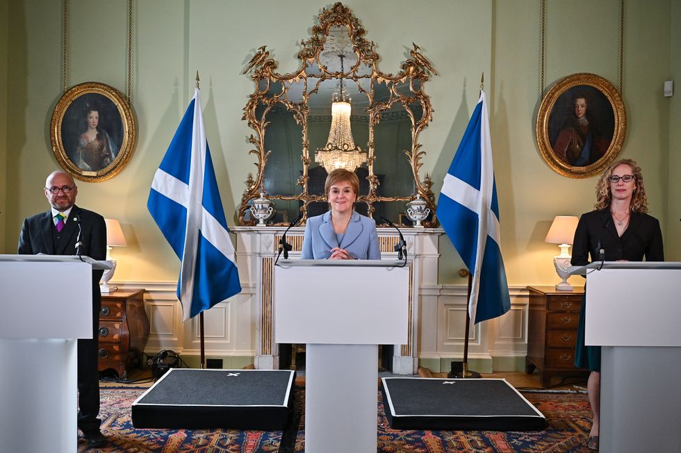 First Minister Nicola Sturgeon (centre) and Scottish Green Party co-leaders Patrick Harvie (left) and Lorna Slater (right) at Bute House, Edinburgh.