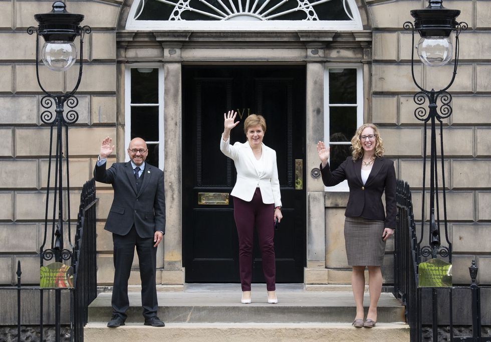 First Minister Nicola Sturgeon (centre) welcoming Scottish Green co-leaders Patrick Harvie and Lorna Slater at Bute House