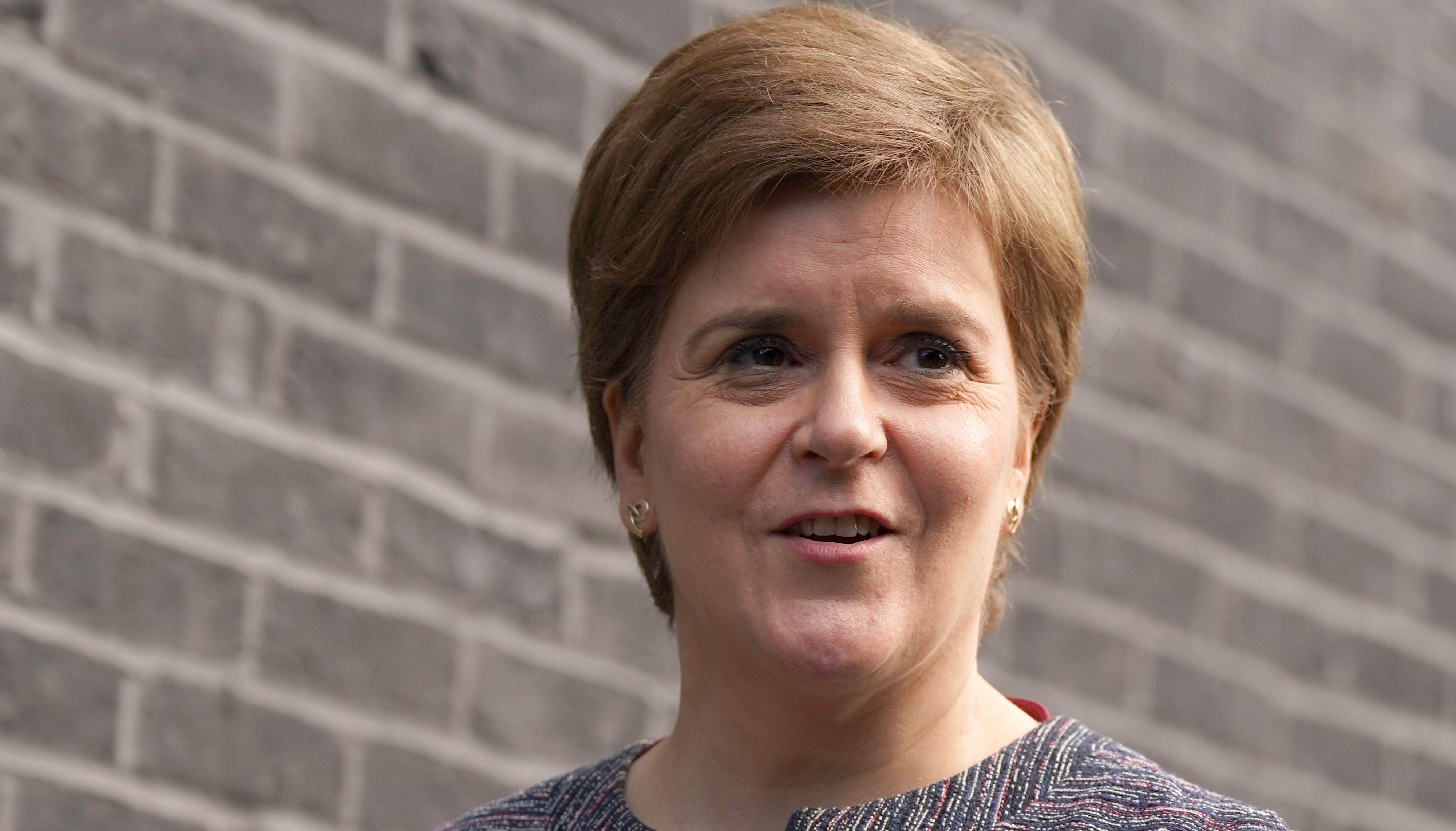 First Minister Nicola Sturgeon holds a book given to her by STUC President Pauline Rourke after she officially opens the Margaret Irwin Centre, which has been named in tribute to the STUC's first secretary, who was instrumental in establishing the organisation 125 years ago