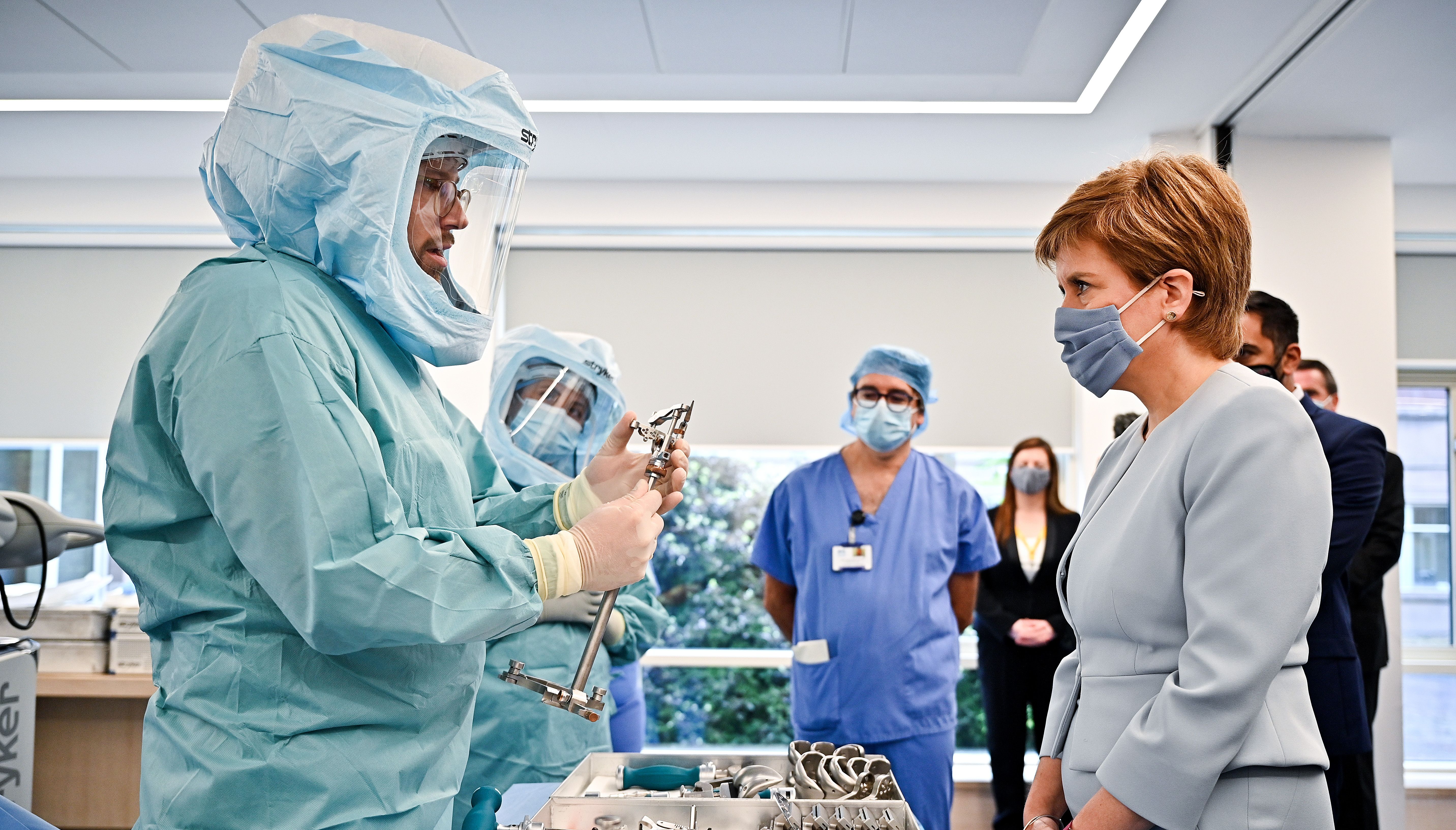 First Minister of Scotland Nicola Sturgeon during a visit to a mock theatre set up with innovative new medical equipment including robotic surgery devices for the launch of the NHS recovery plan at the Golden Jubilee National Hospital in Clydebank.