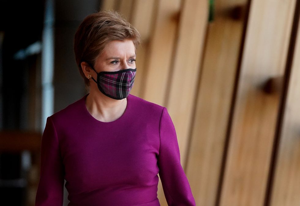 First Minister of Scotland Nicola Sturgeon on her way to First Minister's Questions at the Scottish Parliament in Holyrood.