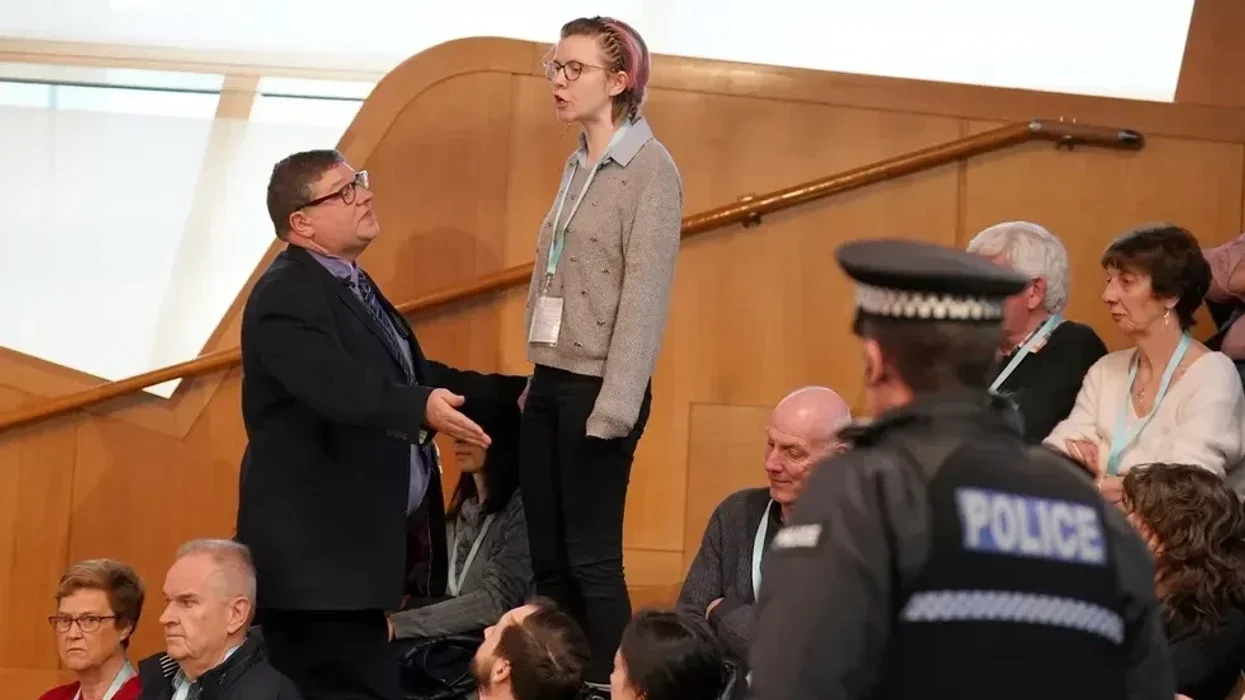 Holyrood descends into chaos as protesters disrupt First Minster's Questions NINE times