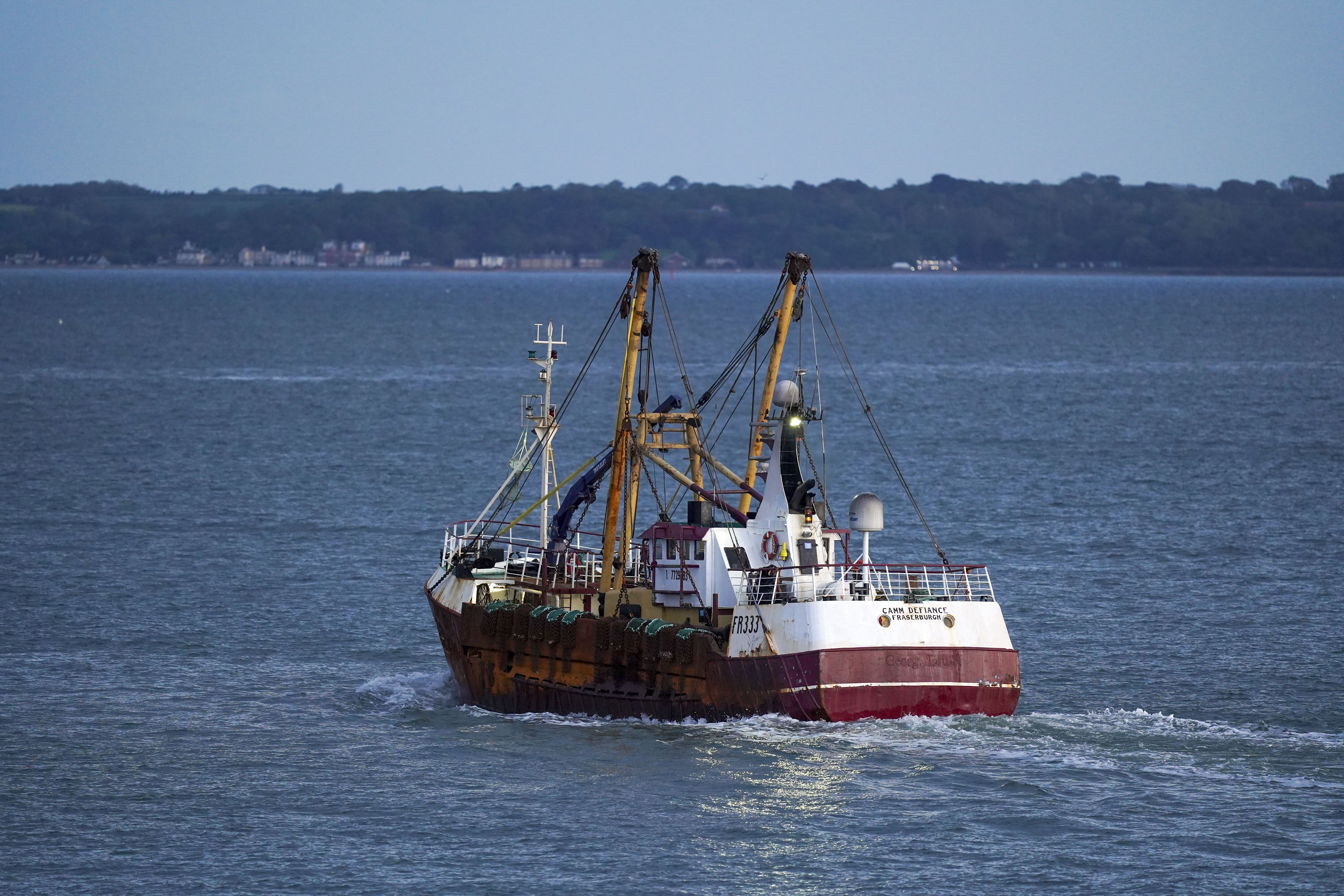 Fishing trawler leaving the harbour in Portsmouth.