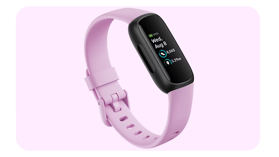 fitbit inspire 3 workout tracker pictured on a pink background showing statistics on screen