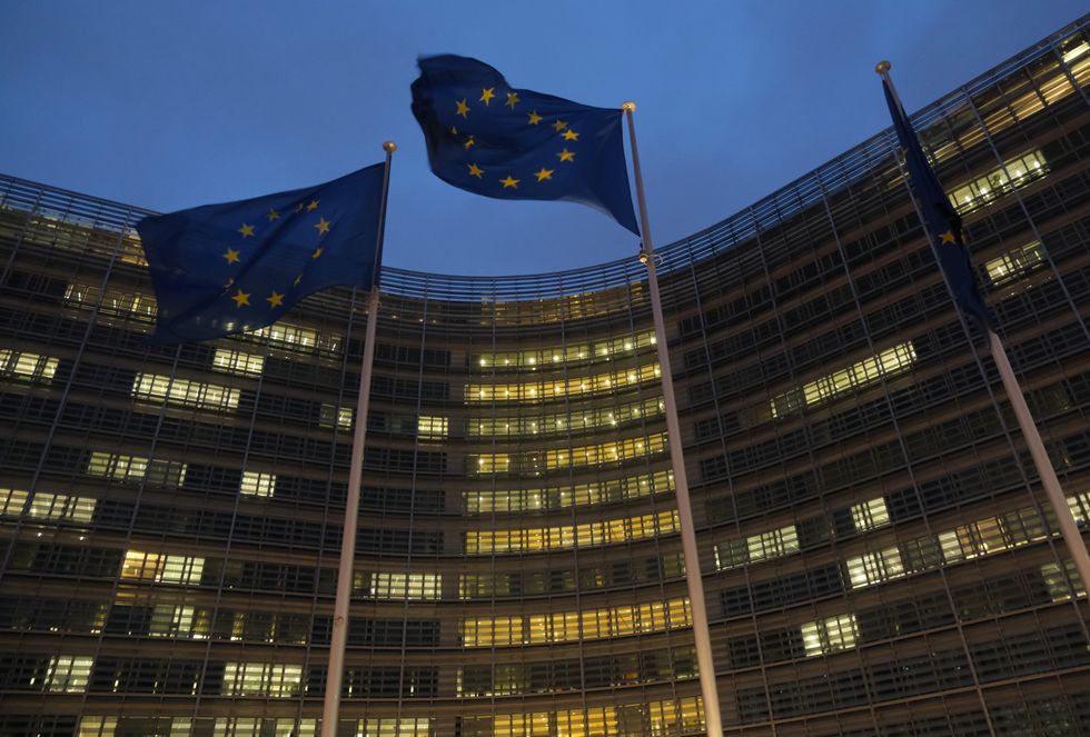 Flags of the European Union fly outside the Berlaymont building of the European Commission