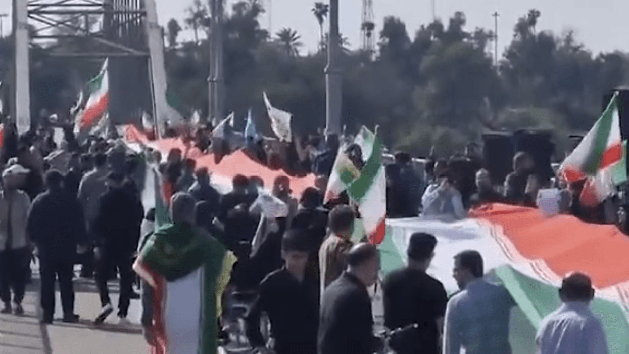 Flags of the regime were raised on bridges