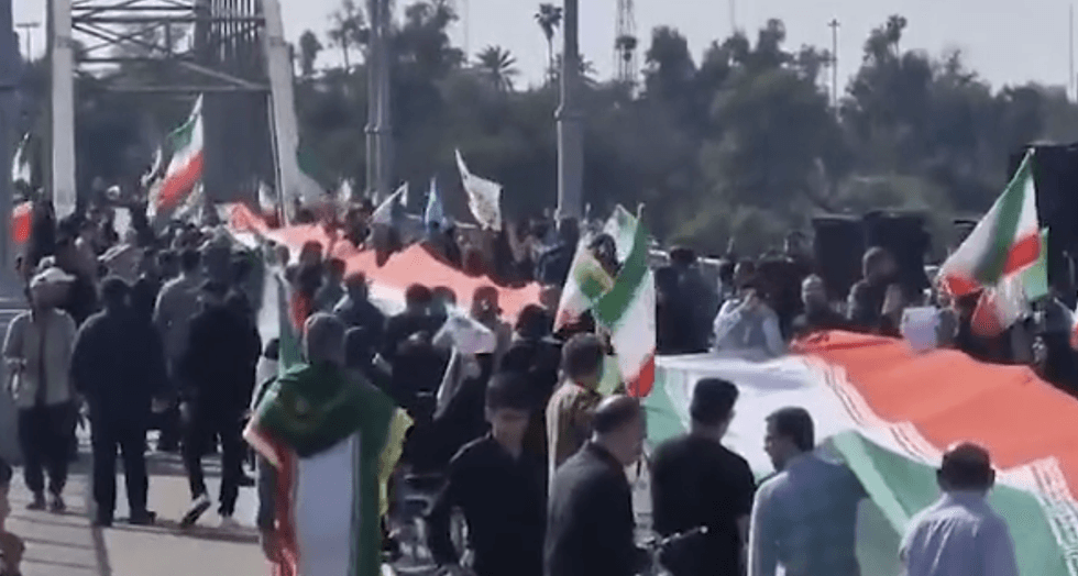 Flags of the regime were raised on bridges