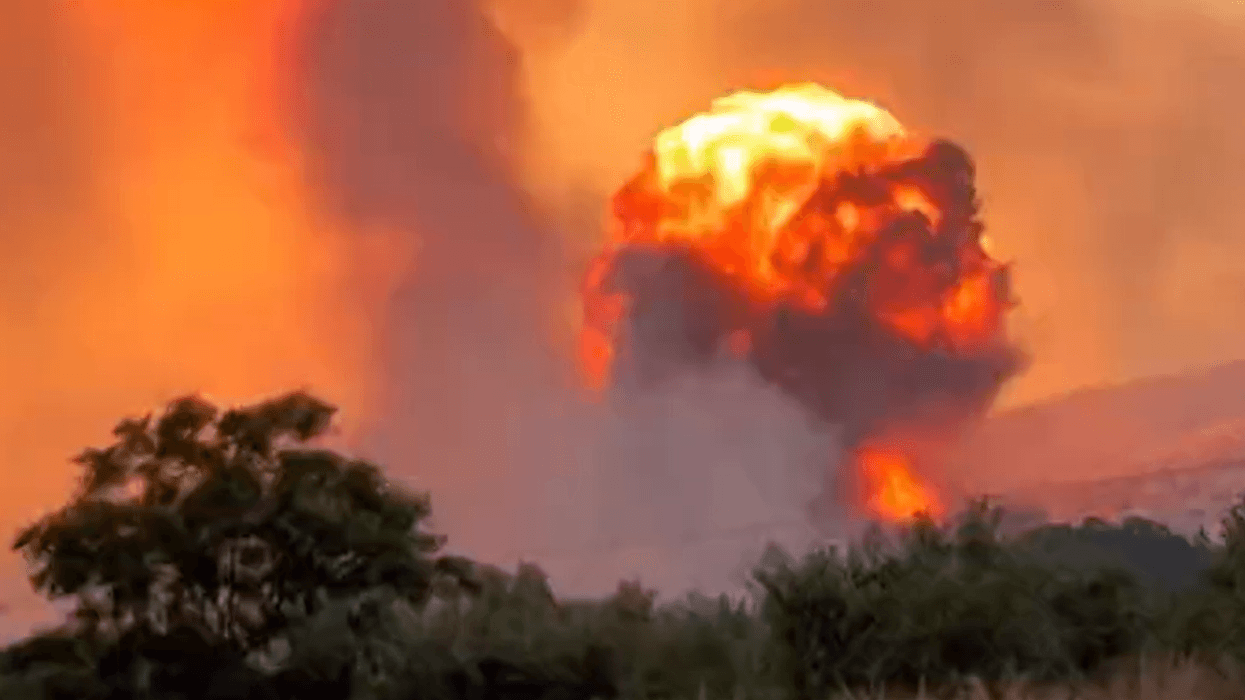 Flames light up sky as wildfires cause major explosions at Greek air force ammunition dump Flames light up sky as wildfires cause major explosions at Greek air force ammunition dump
