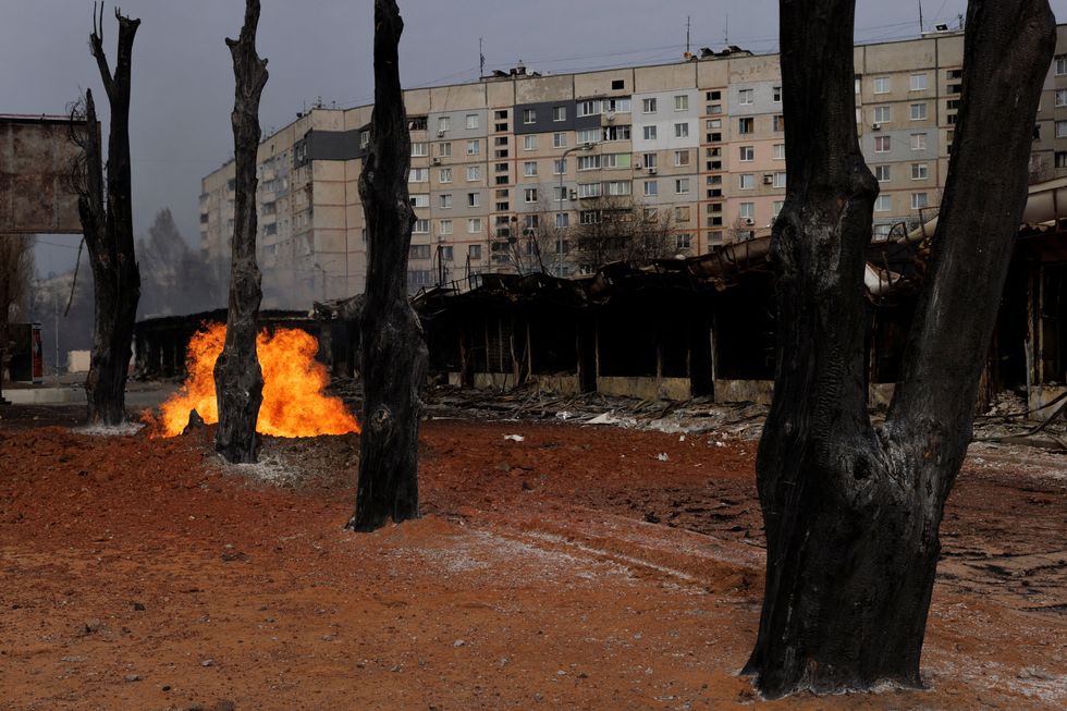 Flames shoot from a gas pipeline after the neighbourhood was shelled from Russian positions in Kharkiv as Russia's attack on Ukraine continues.