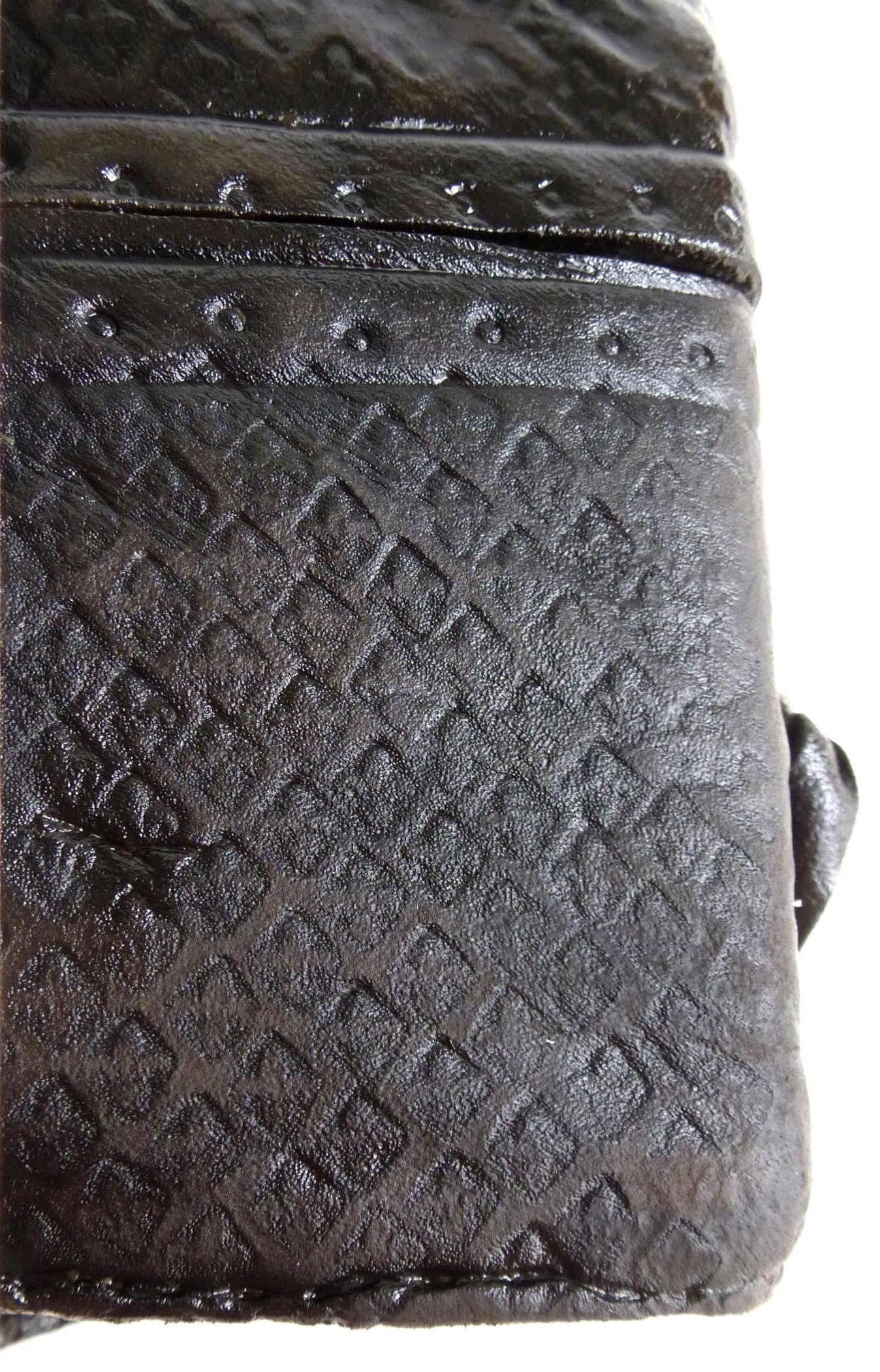 Fleur-de-lis embossed leather cover of notebook