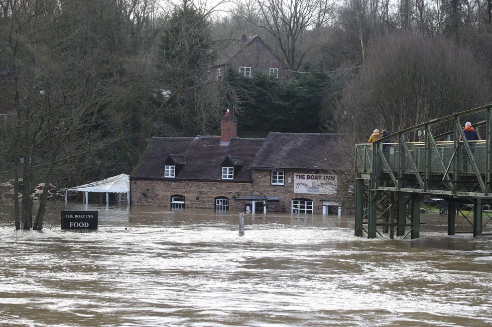 Flood waters from the River Severn surround The Boat Inn at Jackfield near Ironbridge, Shropshire, following high winds and wet weather. The Environment Agency has urged communities in parts of the West Midlands and the north of England, especially those along River Severn, to be prepared for significant flooding until Wednesday following high rainfall from Storm Franklin. Picture date: Tuesday February 22, 2022.