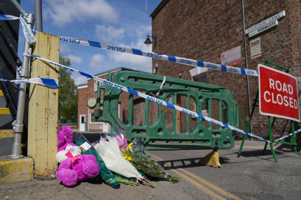 Floral tributes left near to the scene in Boston after a nine-year-old girl died from a suspected stab wound