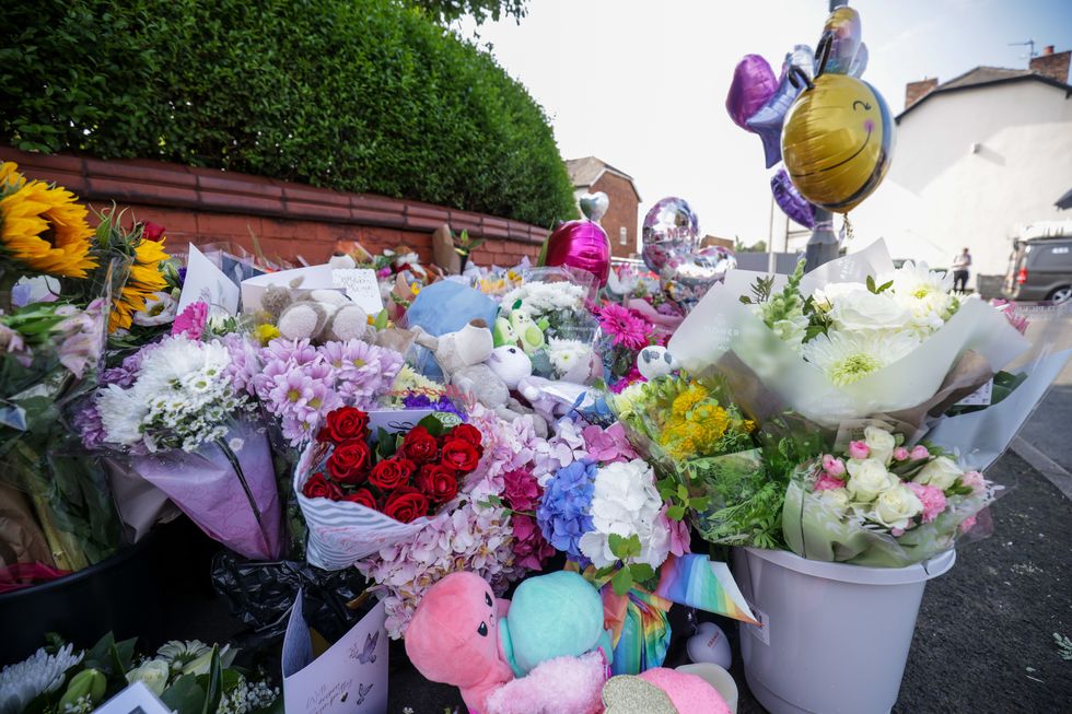 Floral tributes on the junction of Tithebarn Road and Hart Street in Southport