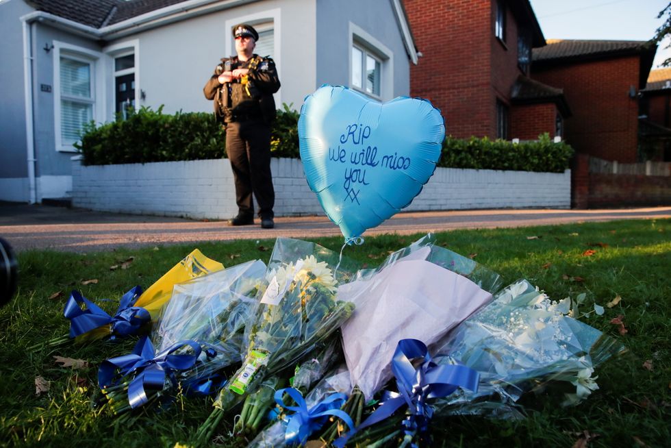 Flowers and a ballon are pictured outside the scene where MP David Amess was stabbed during constituency surgery, in Leigh-on-Sea.