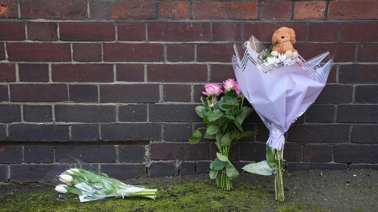 Flowers and a toy left near the Peabody Estate building in Horseferry Road in central London