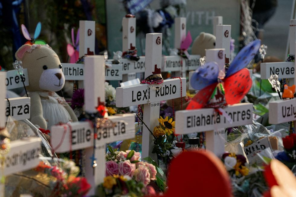 Flowers, toys, and other objects to remember the victims of the deadliest U.S. school mass shooting resulting in the death of 19 children and two teachers, are seen at a memorial at Robb Elementary School in Uvalde, Texas.