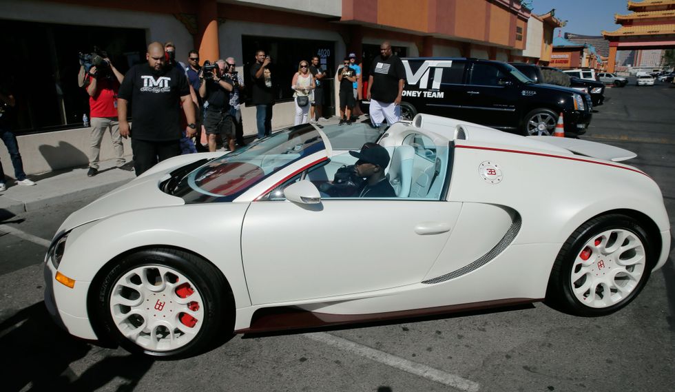 Floyd Mayweather, pictured here in his Bugatti, is set to face Manny Pacquaio later this year