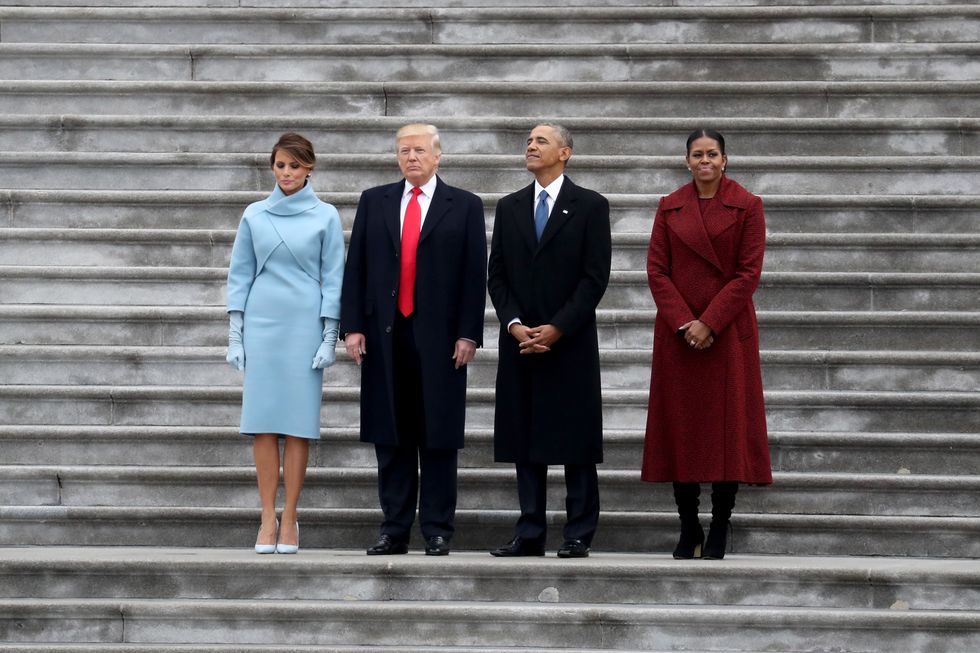 Fomer President Donald Trump and predecessor Barack Obama stand on the steps of the U.S. Capitol with former First Lady Melania Trump and Michelle Obama