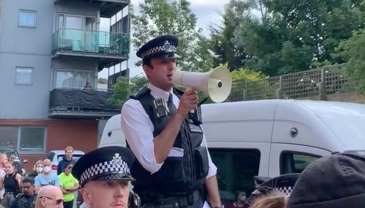 Footage from the scene showed a crowd of people sitting on the ground in front of the vehicle in Peckham