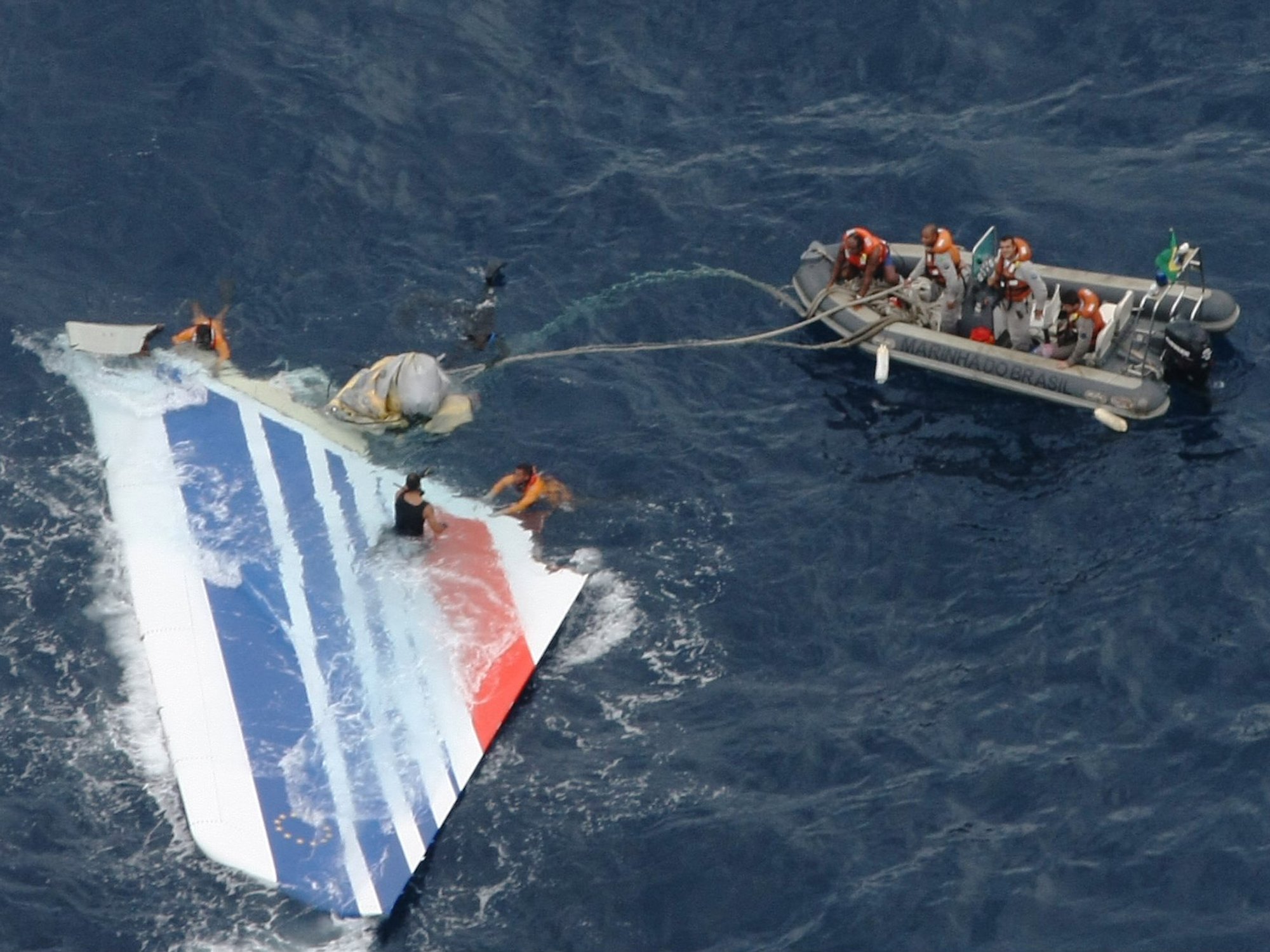 Footage of the crash site shows the tail fin of the aircraft being pulled from the water