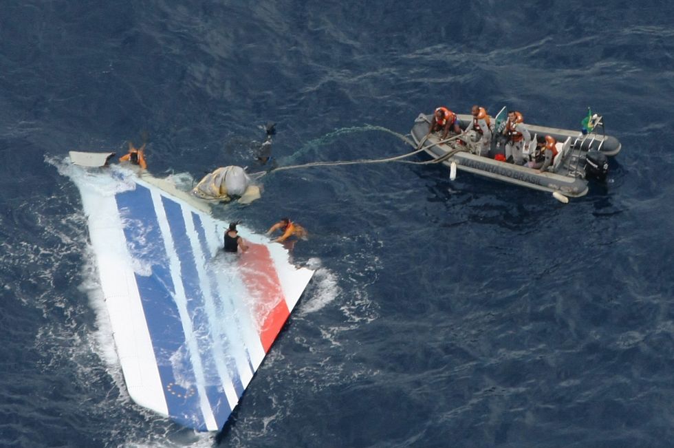 Footage of the crash site shows the tail fin of the aircraft being pulled from the water
