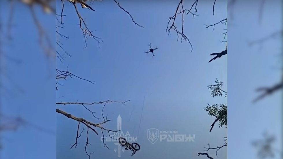 Footage of the e-bike being transported by drone