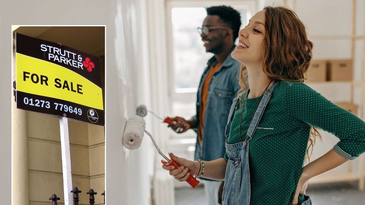 For sale sign / Couple painting walls in house