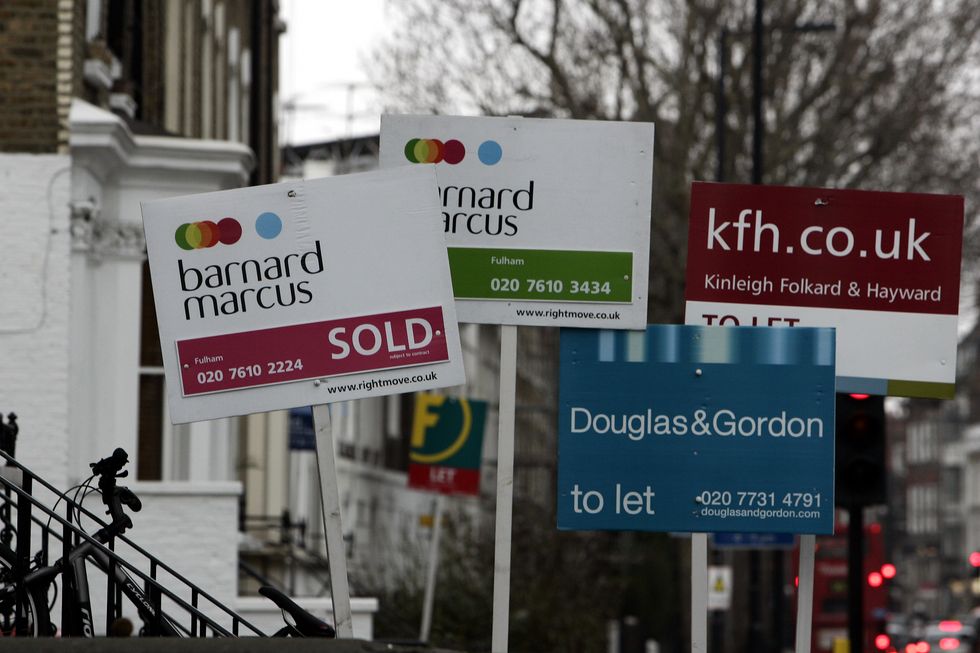 For Sale signs outside houses in Fulham, London