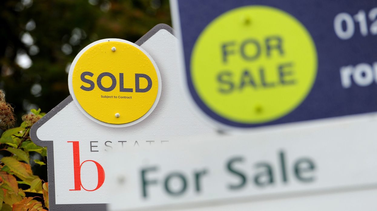 For sale signs posted outside UK homes