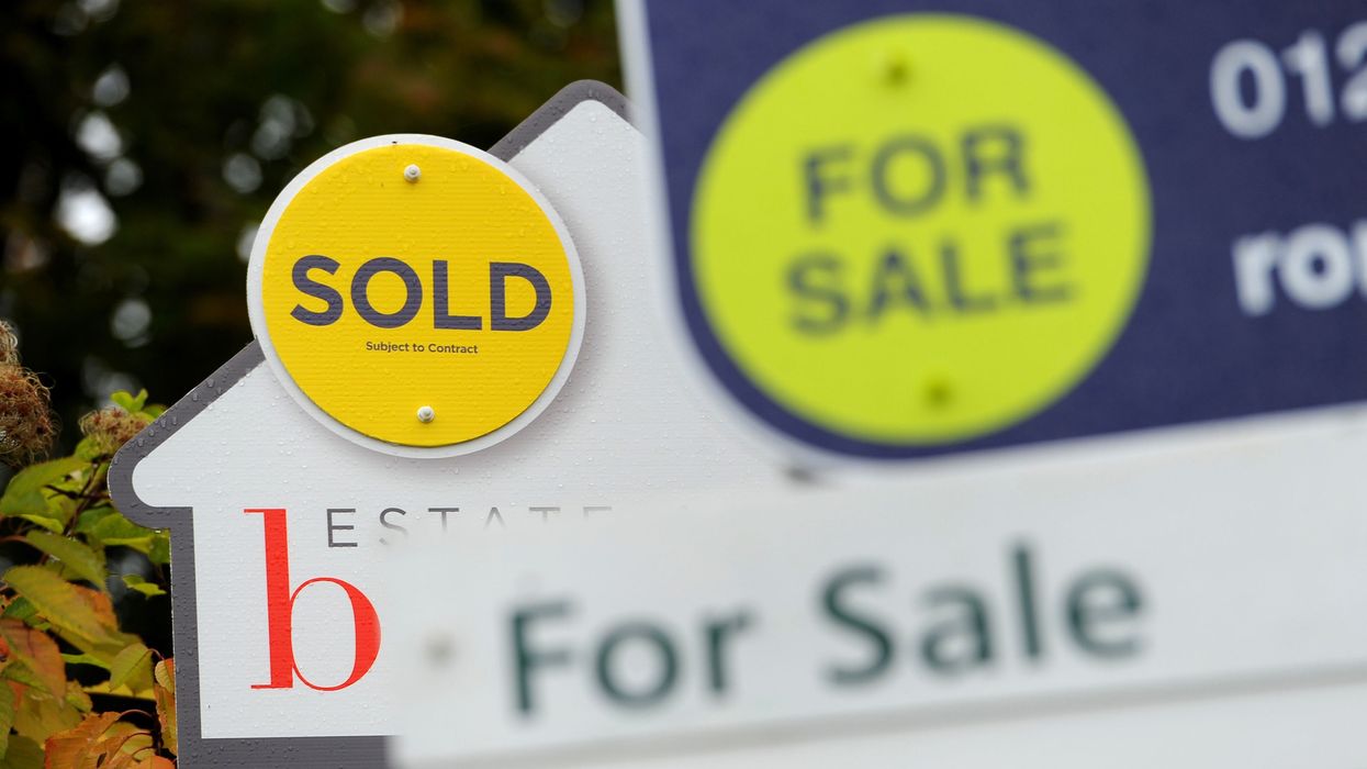 For sale signs posted outside UK homes