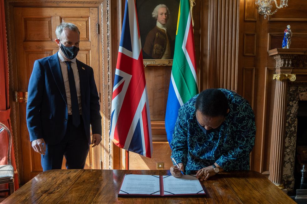 Foreign Secretary Dominic Raab and South Africa's Minister of International Relations and Cooperation, Naledi Pandor, sign a joint ministerial statement at post G7 talks at Chevening House, Kent in May