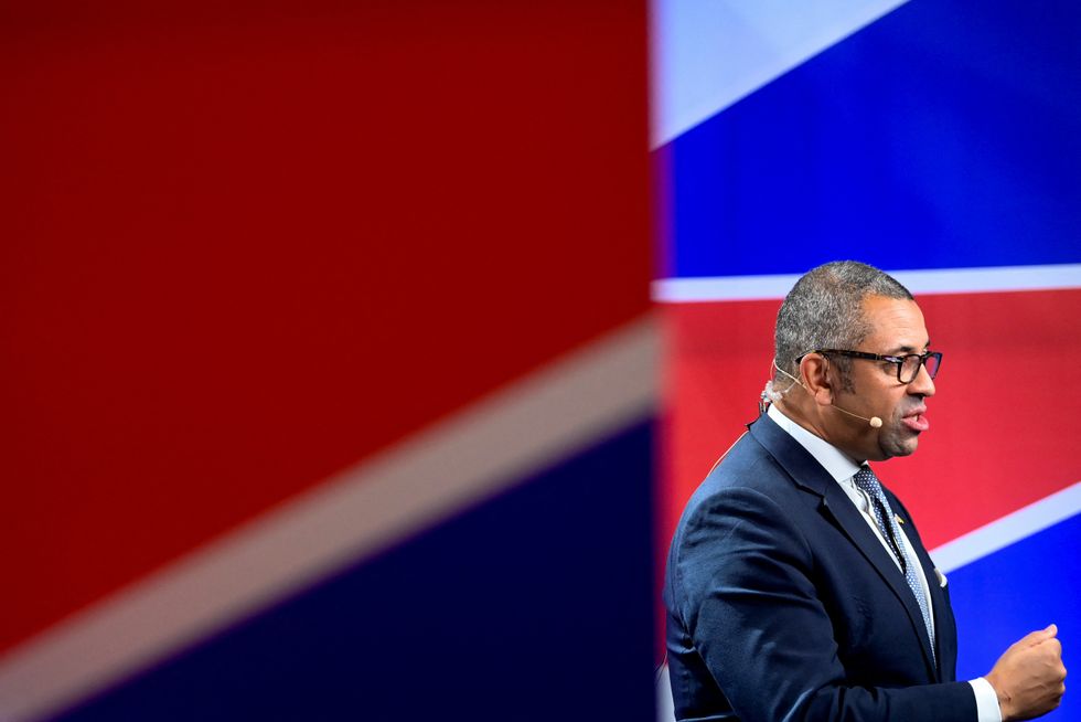 Foreign Secretary James Cleverly takes part in a television interview, at Britain's Conservative Party's annual conference in Birmingham