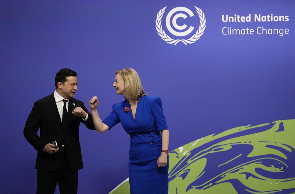 Foreign Secretary Liz Truss (right) greets Ukraine's President Volodymyr Zelensky at the Cop26 summit at the Scottish Event Campus (SEC) in Glasgow. Picture date: Monday November 1, 2021.