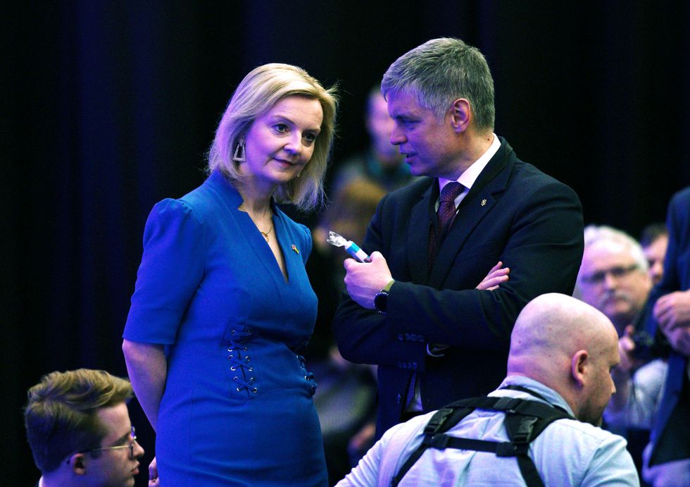 Foreign Secretary Liz Truss talks with Ambassador of Ukraine to the UK, Vadym Prystaiko following her speech at the Conservative Party Spring Forum at Winter Gardens, Blackpool.
