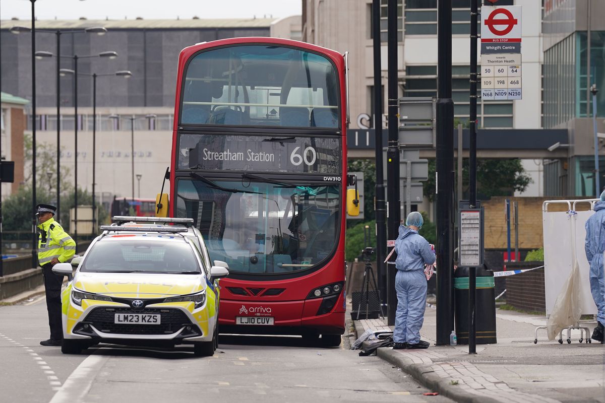 Forensic investigators at the scene near the Whitgift shopping centre in Croydon, south London after a 15-year-old girl was stabbed to death on Wednesday morning